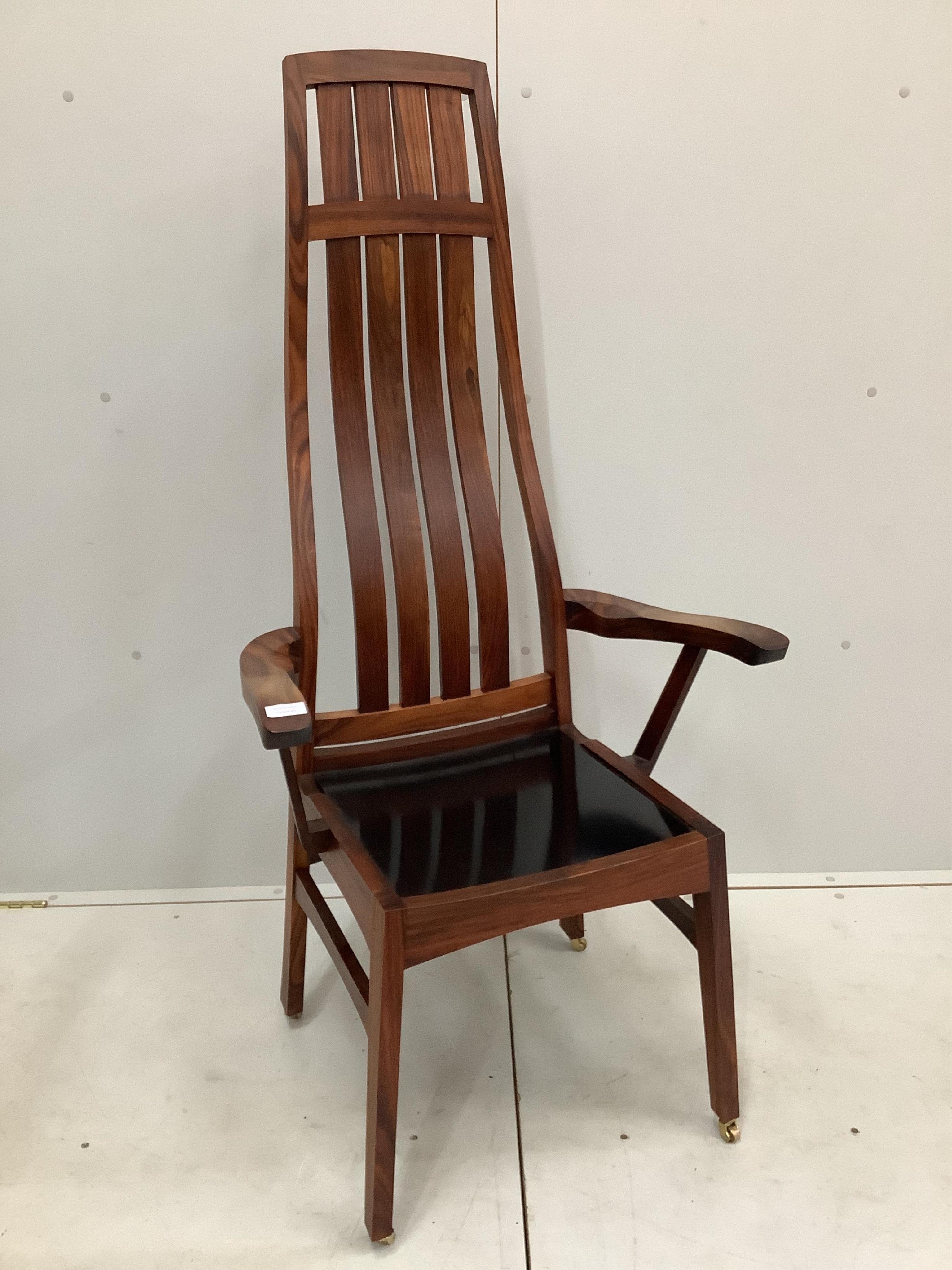 Anthony Millett, a contemporary hardwood high backed elbow chair, 1993, width 63cm, depth 50cm, height 135cm